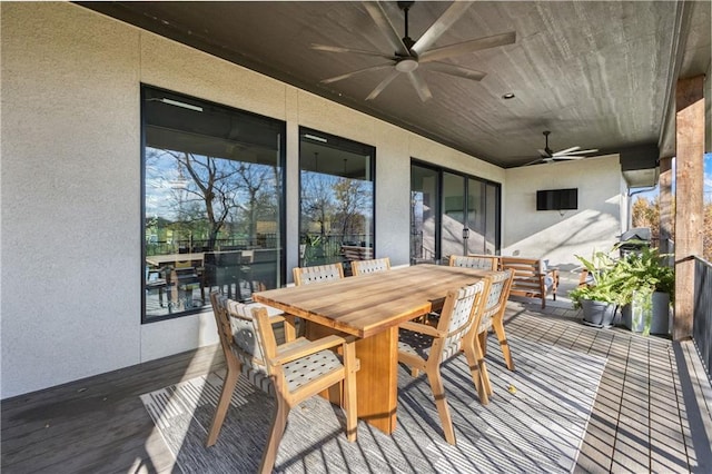 wooden terrace featuring ceiling fan