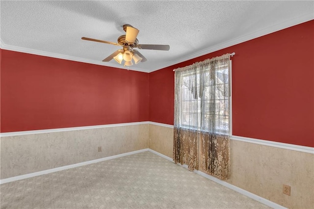 unfurnished room featuring ceiling fan, carpet flooring, and a textured ceiling