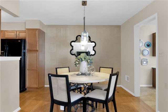 dining area featuring light hardwood / wood-style floors