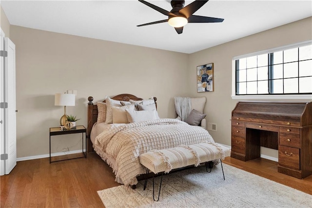 bedroom with wood-type flooring and ceiling fan