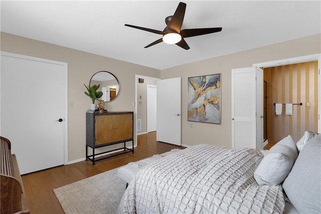 bedroom featuring ceiling fan and dark hardwood / wood-style flooring