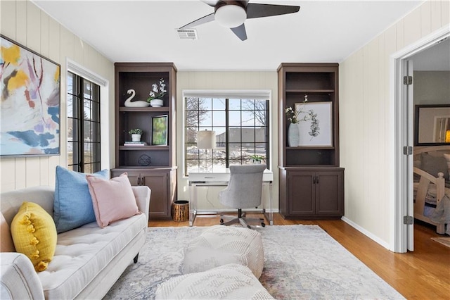 interior space featuring ceiling fan, plenty of natural light, and light hardwood / wood-style floors