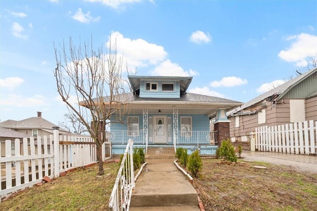 bungalow-style house featuring fence and a porch