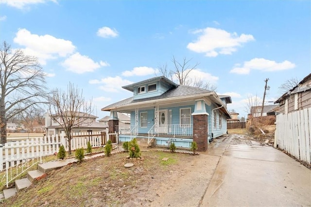 bungalow-style home featuring fence and a porch