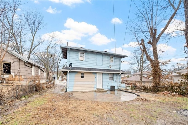 rear view of house featuring entry steps, a patio area, and cooling unit