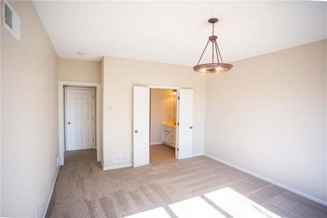 unfurnished bedroom featuring light colored carpet