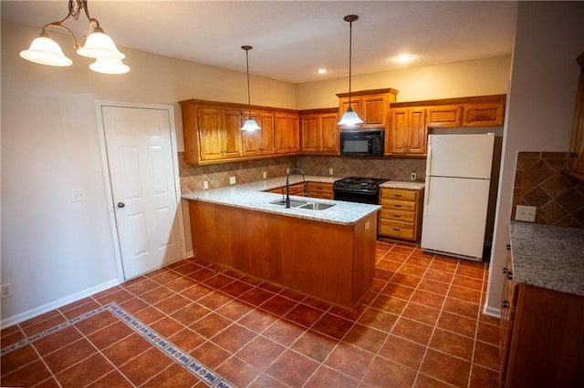 kitchen featuring black appliances, sink, decorative backsplash, hanging light fixtures, and kitchen peninsula