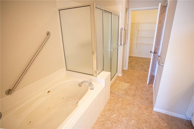 bathroom with tile patterned flooring and plus walk in shower