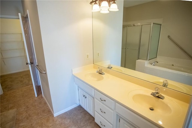 bathroom with tile patterned flooring, vanity, and separate shower and tub