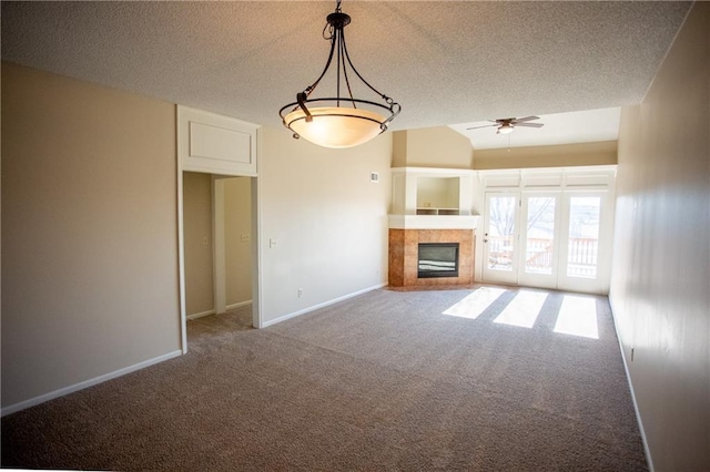 6323 W 145th St, Overland Park, KS 66223 - unfurnished living room with carpet flooring, a tile fireplace, a textured ceiling, a ceiling fan, and baseboards