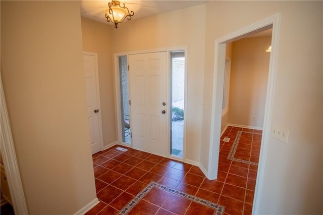 6323 W 145th St, Overland Park, KS 66223 - foyer entrance with dark tile patterned floors and baseboards