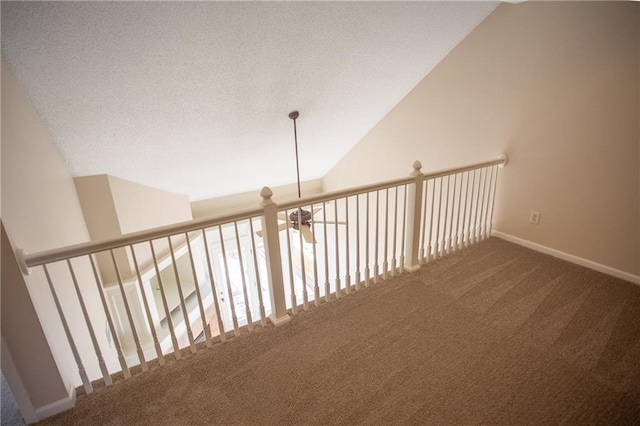6323 W 145th St, Overland Park, KS 66223 - hall featuring carpet flooring, lofted ceiling, a textured ceiling, and baseboards