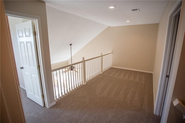 6323 W 145th St, Overland Park, KS 66223 - corridor featuring carpet floors, a textured ceiling, vaulted ceiling, baseboards, and recessed lighting