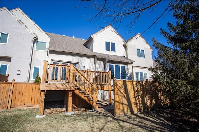 6323 W 145th St, Overland Park, KS 66223 - rear view of house with a deck, a shingled roof, and stairway