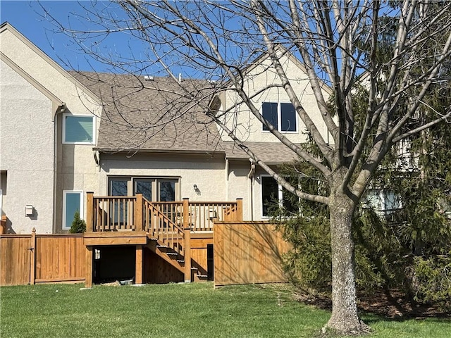 6323 W 145th St, Overland Park, KS 66223 - rear view of house with stucco siding, a deck, roof with shingles, and stairway