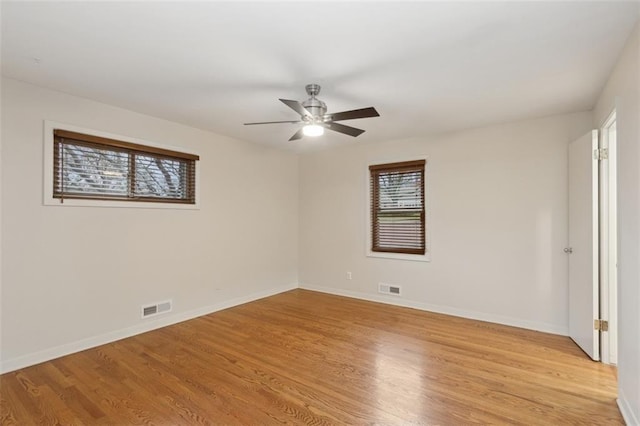 unfurnished room featuring ceiling fan and light wood-type flooring