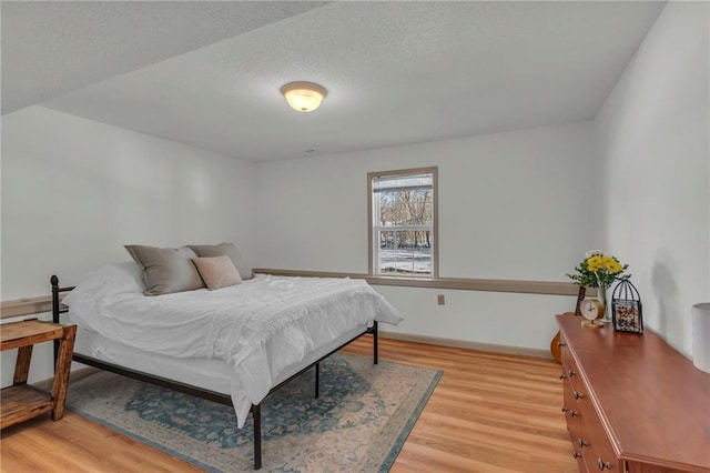 bedroom with light hardwood / wood-style floors