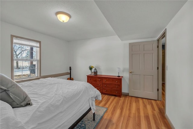 bedroom featuring light wood-type flooring