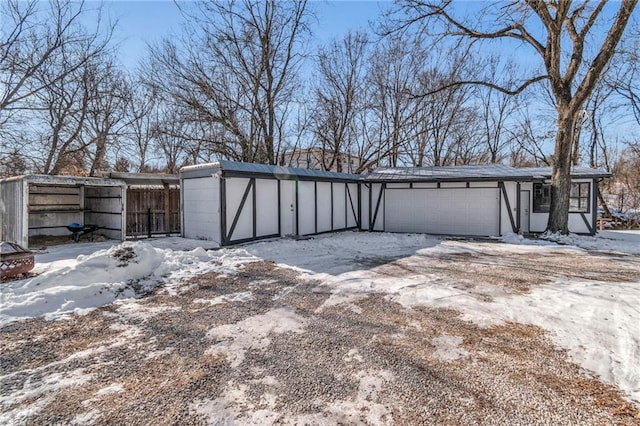 view of snow covered garage