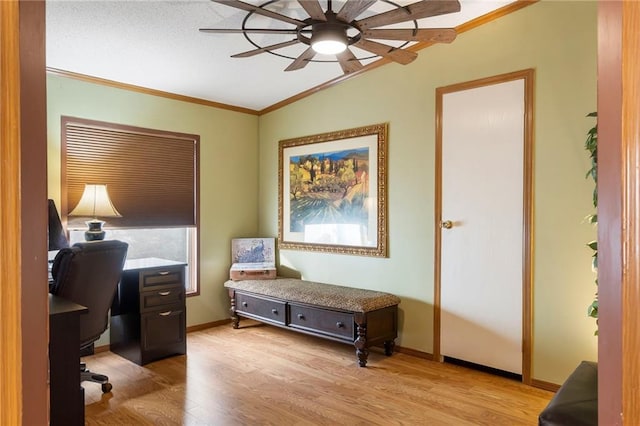 home office featuring crown molding, lofted ceiling, ceiling fan, and light hardwood / wood-style flooring