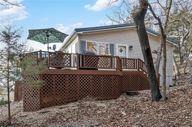 rear view of property with a deck