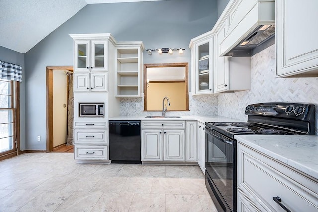 kitchen featuring lofted ceiling, sink, custom exhaust hood, black appliances, and backsplash