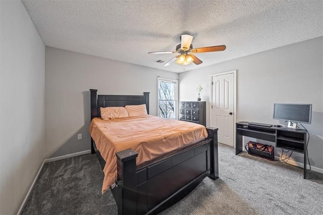 carpeted bedroom featuring a textured ceiling and ceiling fan