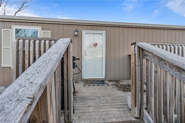 doorway to property with a wooden deck