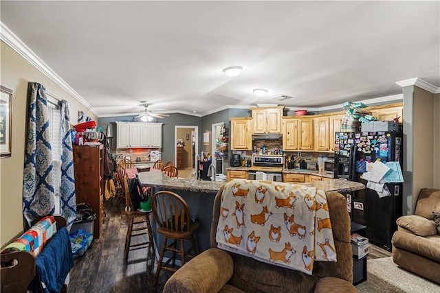 kitchen with tasteful backsplash, black fridge with ice dispenser, a kitchen island with sink, and electric range