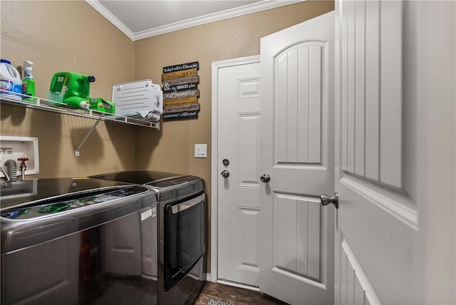 laundry room featuring crown molding and washer and dryer