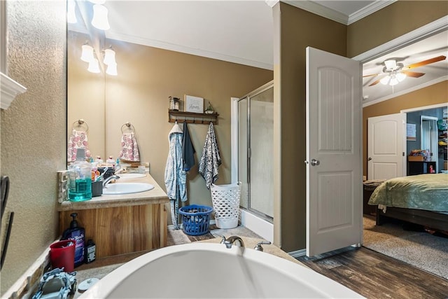 bathroom with vanity, crown molding, separate shower and tub, and hardwood / wood-style flooring