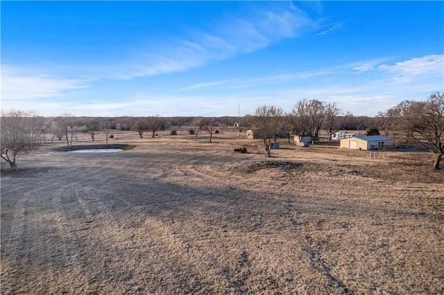 view of yard with a rural view