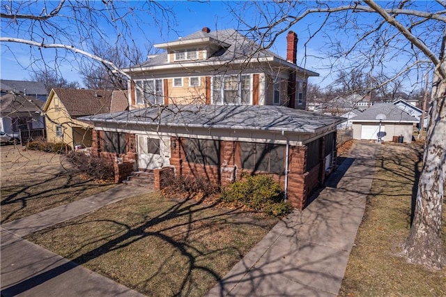 view of front of home with an outbuilding and a garage