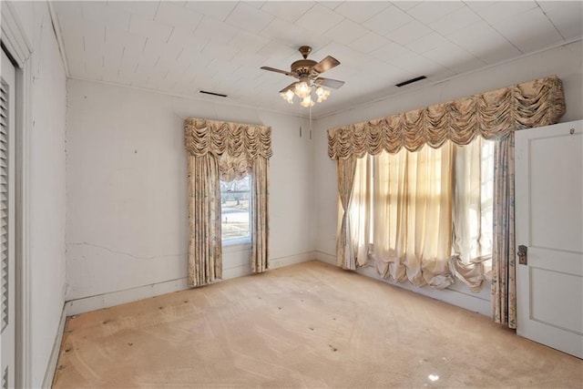 carpeted empty room with ceiling fan