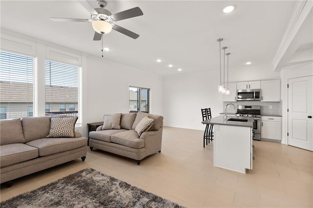 living room with sink and ceiling fan