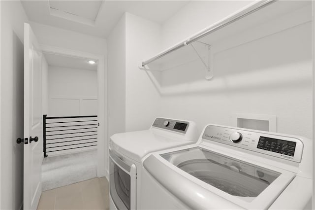 laundry area with separate washer and dryer