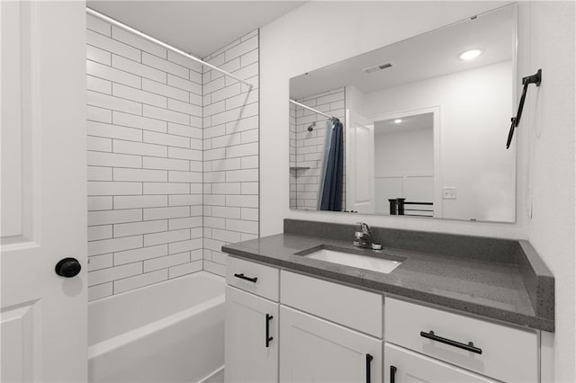 bathroom with vanity and shower / bath combo with shower curtain