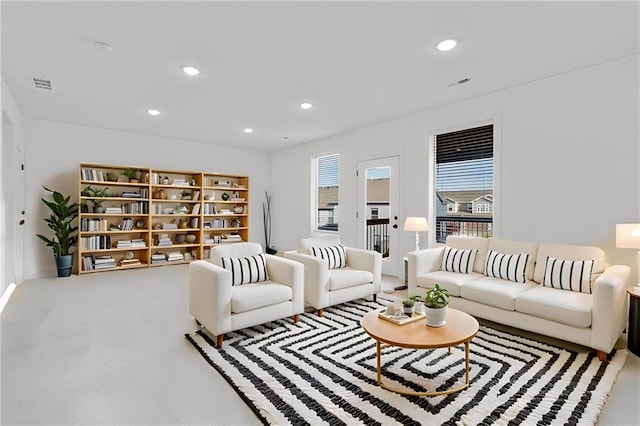 living room featuring concrete flooring