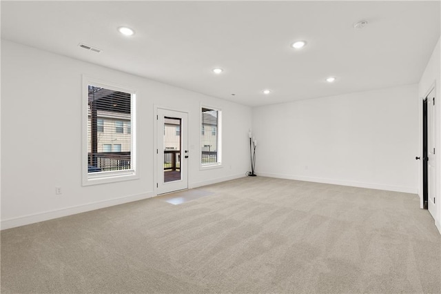 empty room with light colored carpet