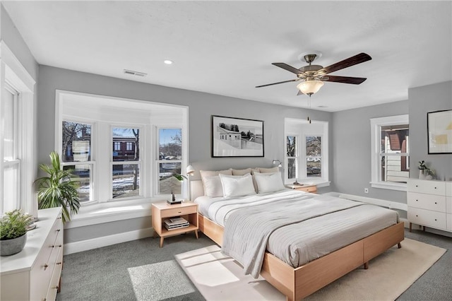 carpeted bedroom with ceiling fan