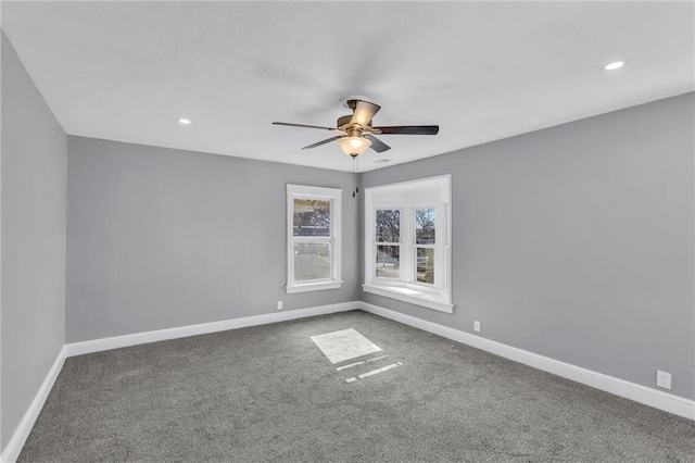 empty room featuring carpet and ceiling fan