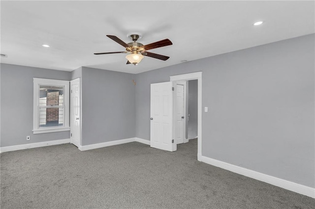 spare room with ceiling fan and carpet floors