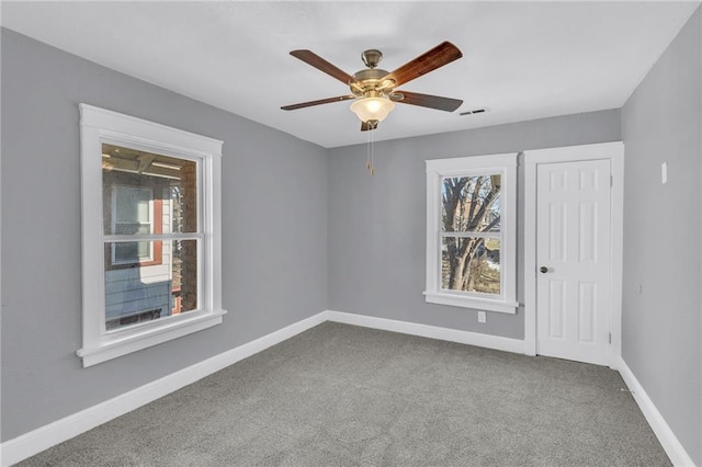 carpeted empty room with ceiling fan