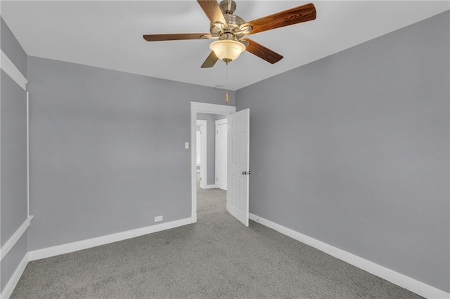 unfurnished room with light carpet and ceiling fan