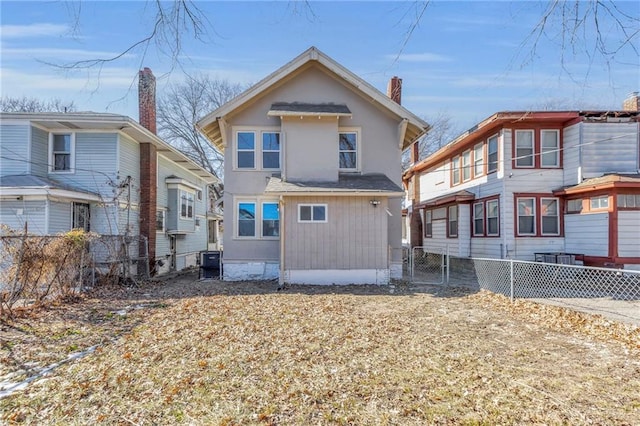 back of property featuring central air condition unit