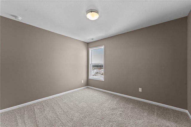 unfurnished room featuring carpet flooring