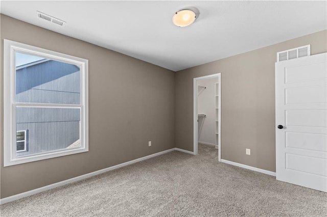 unfurnished room featuring carpet flooring