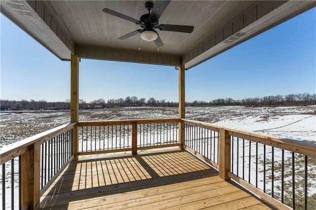 snow covered deck featuring ceiling fan