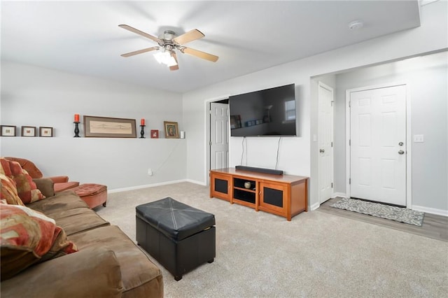 living room featuring ceiling fan and carpet flooring