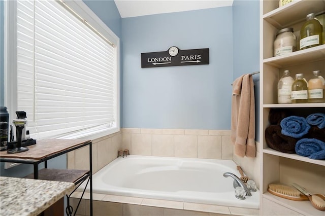 bathroom featuring tiled bath